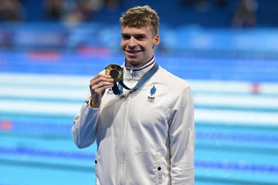 Marchand cements legacy with 4th gold